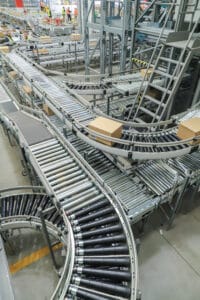 packing line in a logistics warehouse. conveyor belt in a modern production line